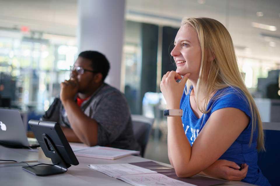 Two students in classroom looking forward